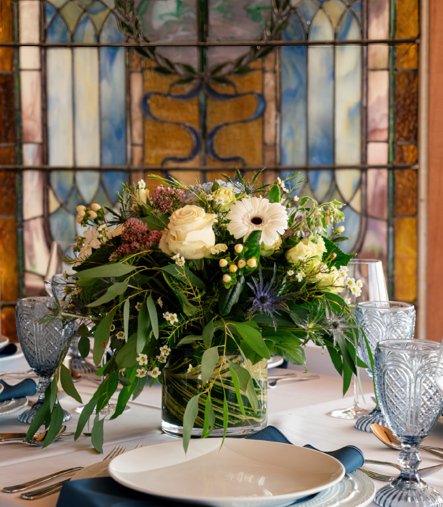 a table with a vase of flowers on it