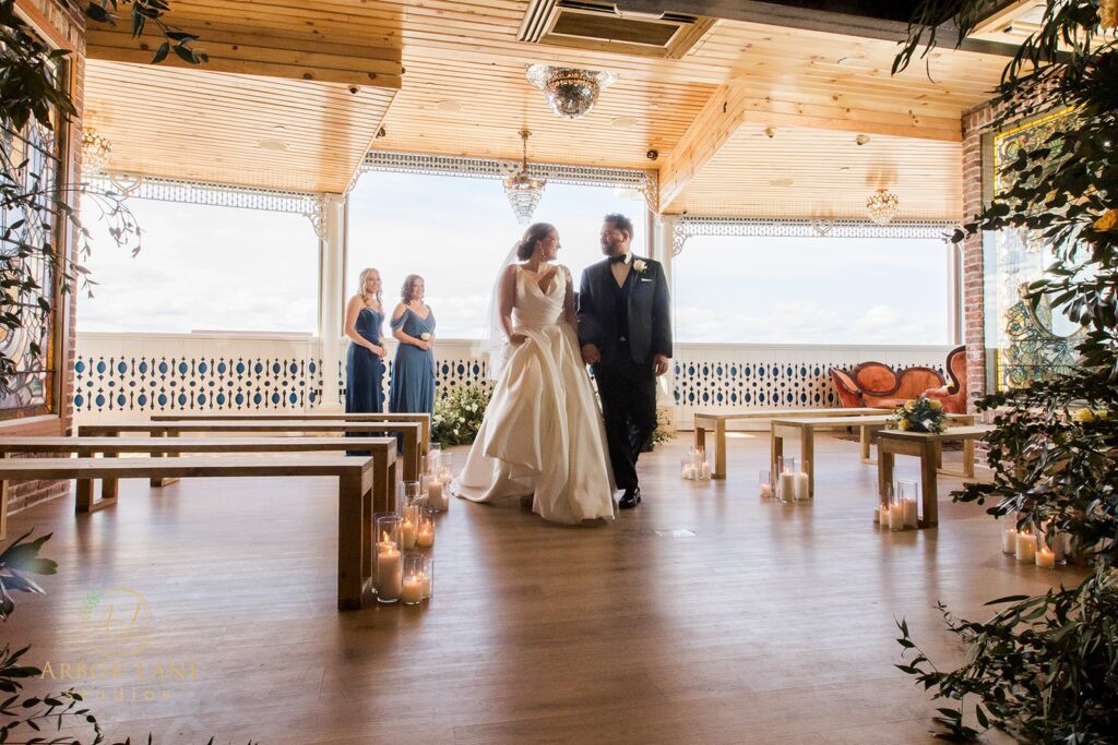 a bride and groom walking down the aisle