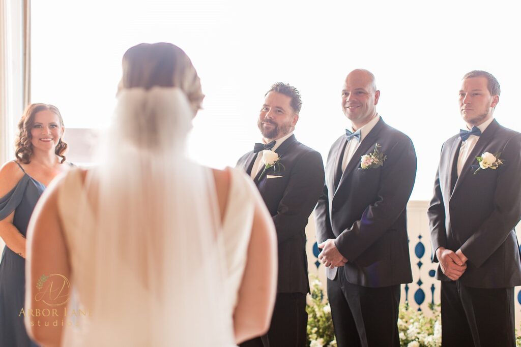 a group of people standing in front of a window