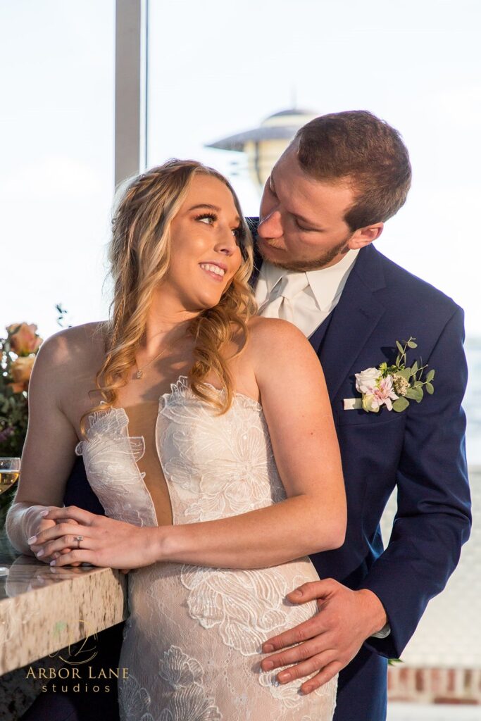 a bride and groom standing next to each other