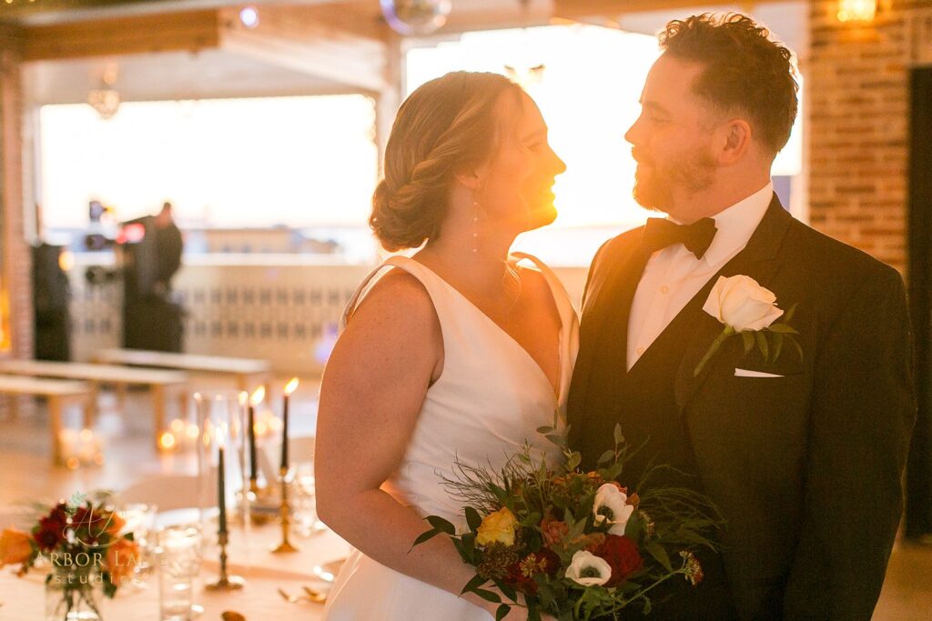 a bride and groom standing next to each other