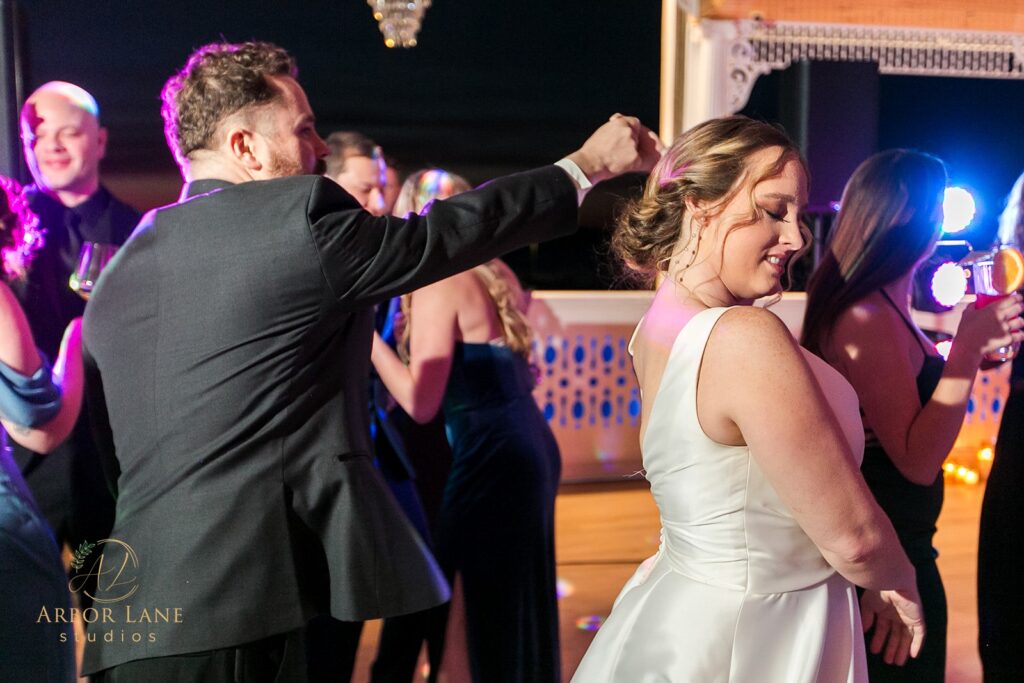 a bride and groom dancing at their wedding reception