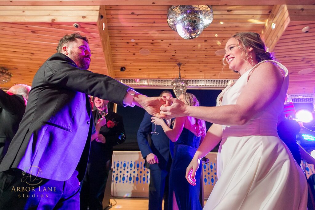 a bride and groom dancing at their wedding reception