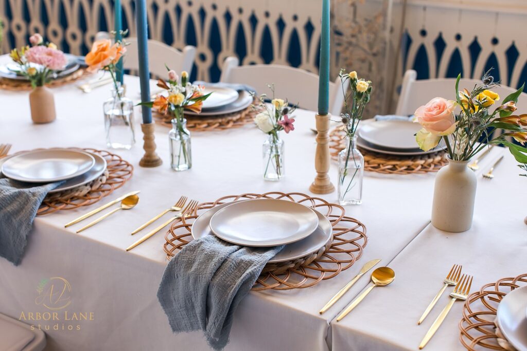 a table set with plates and place settings