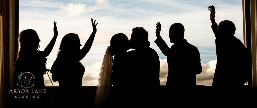 a group of people standing in front of a window