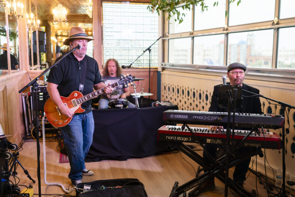 a group of people playing instruments in a room