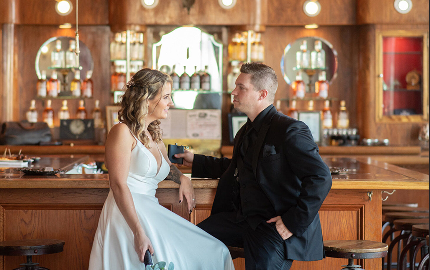 a man and a woman sitting at a bar