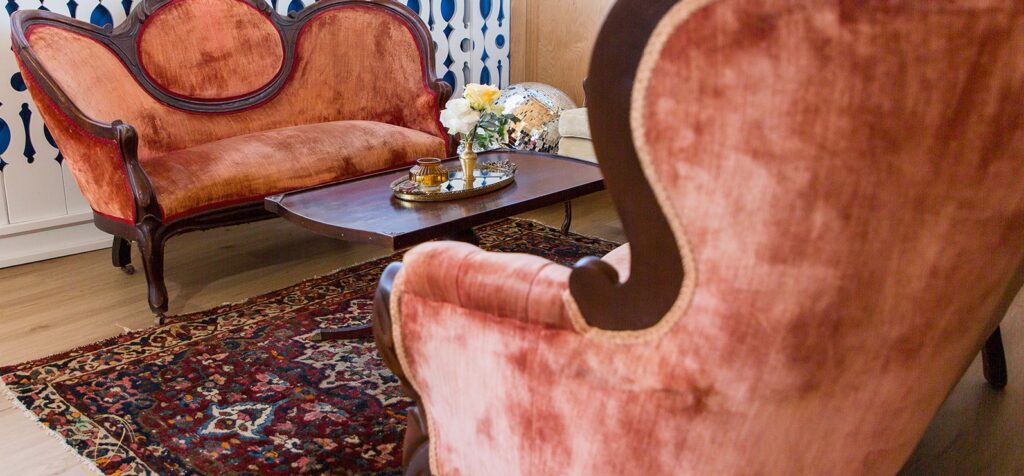 a living room filled with furniture and a large window