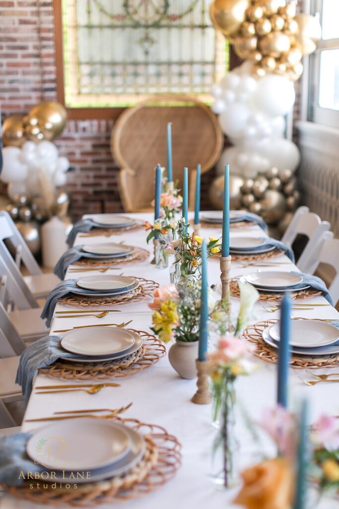 a table set for a party with plates and place settings