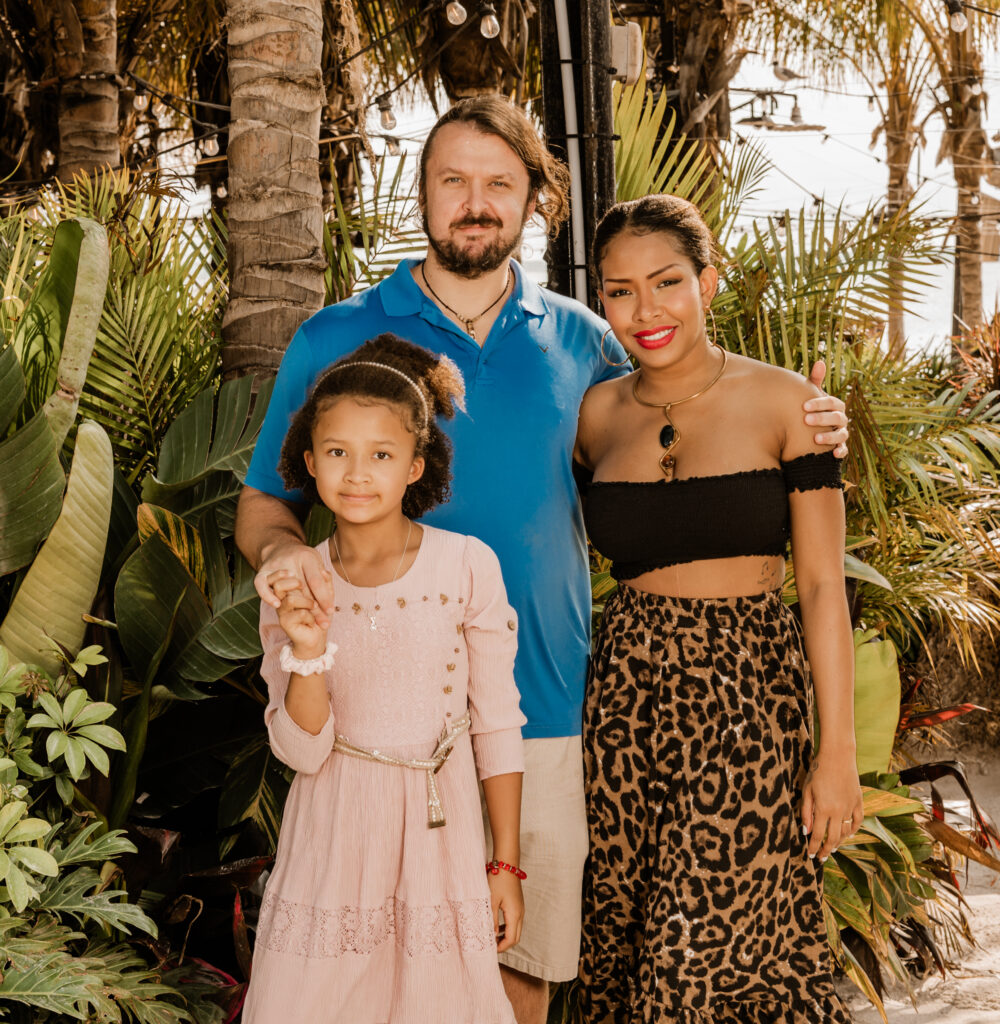 a man and two women standing next to each other