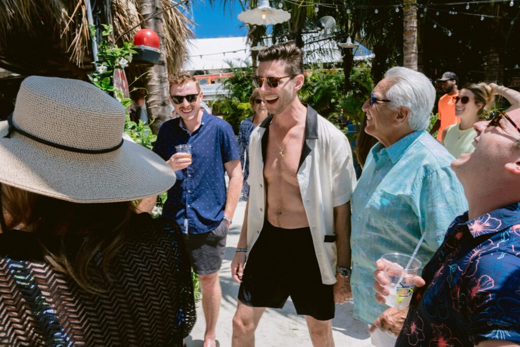 a group of people standing around each other