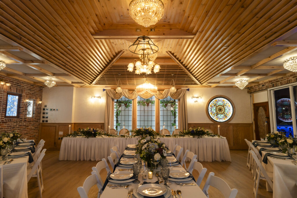 a banquet hall with tables and chairs set up for a formal function