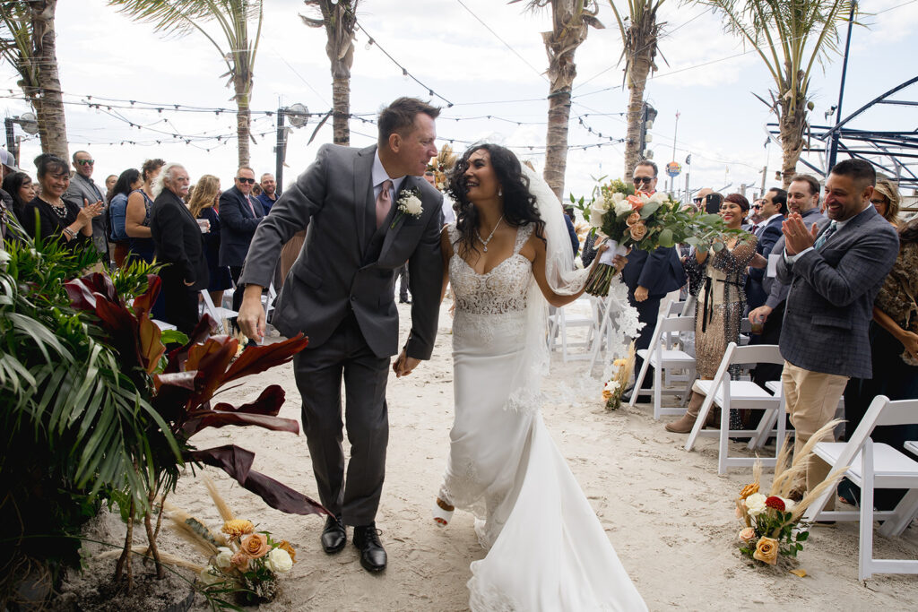 a newly married couple walking down the aisle