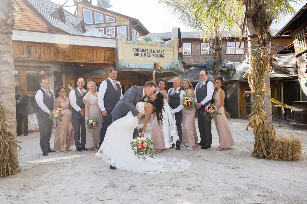 a group of people that are standing in the sand