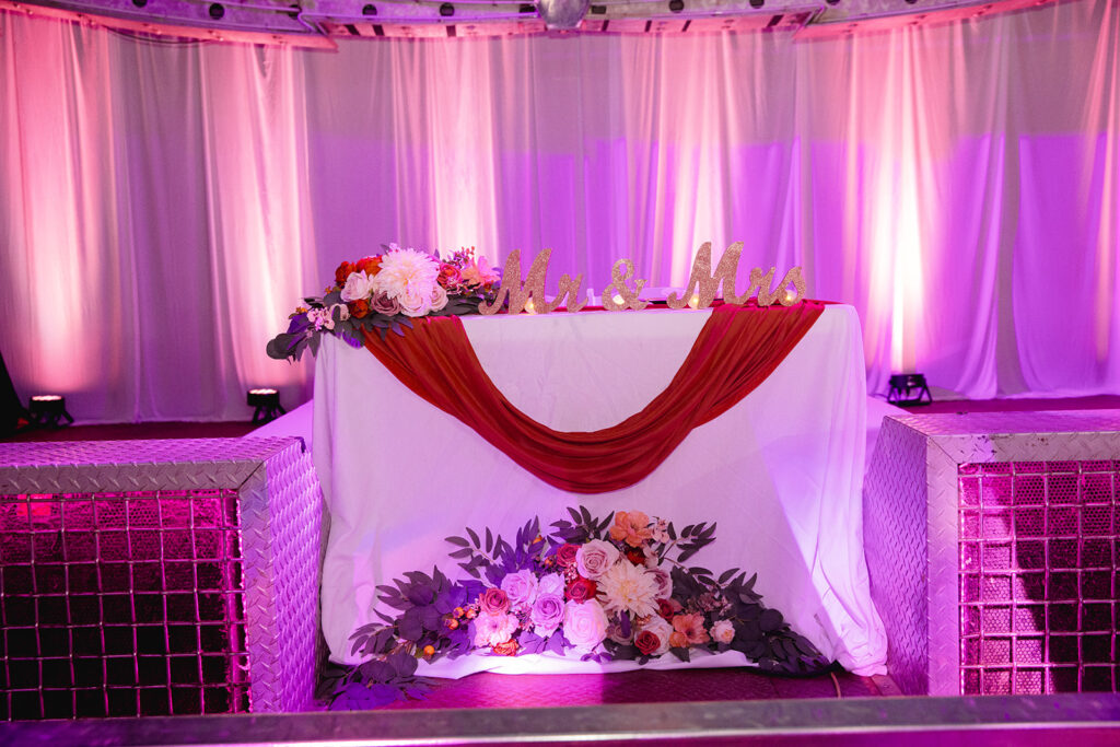 a table with flowers and candles on it