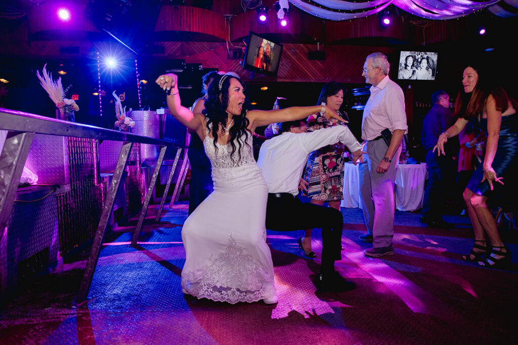 a bride and groom dancing on the dance floor