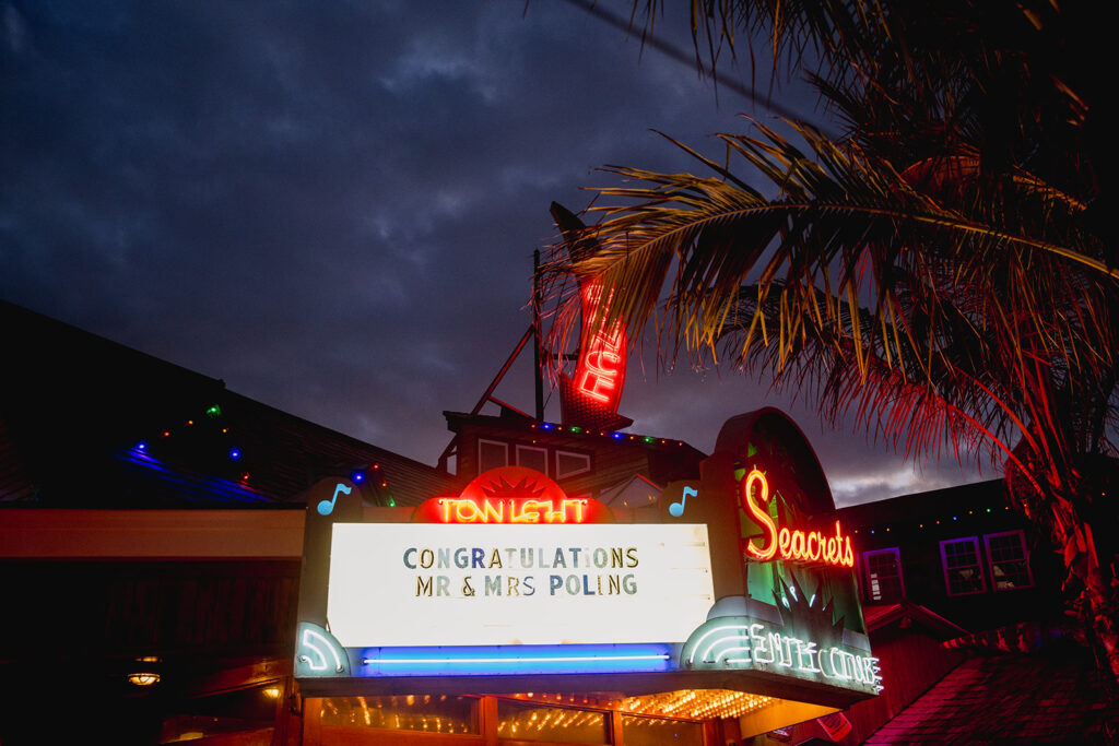 a sign that is lit up at night